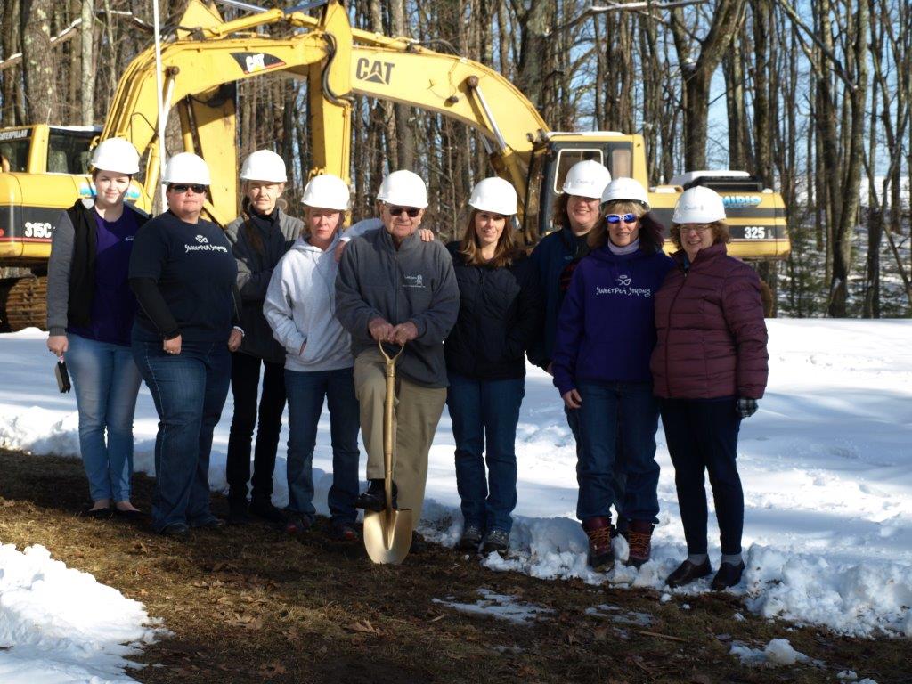 The Board of Directors celebrating groundbreaking for the new shelter.